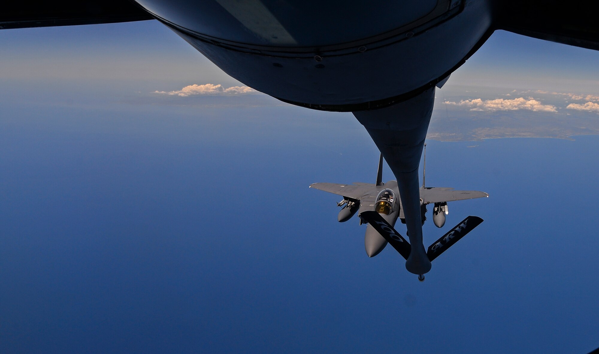 A U.S. Air Force F-15E Strike Eagle prepares to receive fuel from a KC-135 Stratotanker May 3, 2017. Each of the low-drag conformal fuel tanks that hug the F-15E's fuselage can carry 750 gallons of fuel. The tanks hold weapons on short pylons rather than conventional weapon racks, reducing drag and further extending the range of the Strike Eagle. (U.S. Air Force photo by Staff Sgt. Micaiah Anthony)