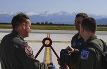 U.S. Air Force Capt. Bobby Stanford, 351st Air Refueling Squadron mission commander, left, U.S. Air Force Capt. Robert Allen, 351st ARS instructor pilot, center and U.S. Air Force Staff Sgt. Bobby Cash, 351st ARS boom operator, debrief about the refueling flight May 3, 2017, at Naval Support Activity Souda Bay, Greece. The aircrew landed at NSA Souda Bay to refuel the KC-135 Stratotanker they used to support air to air refueling with F-15E Strike Eagles. (U.S. Air Force photo by Staff Sgt. Micaiah Anthony)