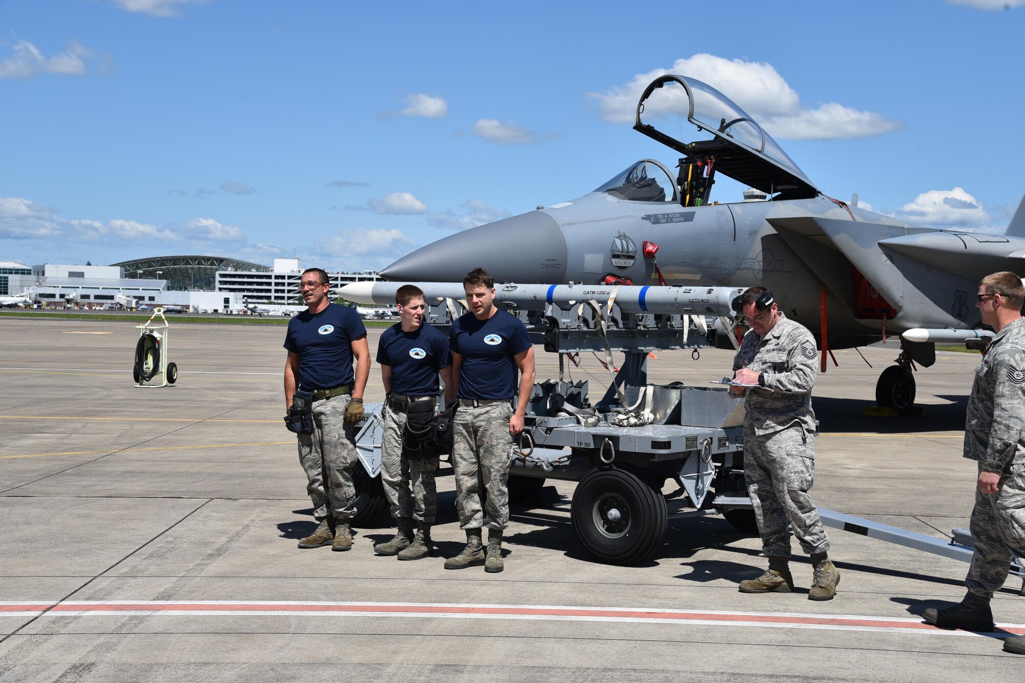 Oregon Air National Guard’s 142nd Aircraft Maintenance Squadron, aircraft armament ordinance journeymen, participate in a F-15 Eagle weapons load contest to see which team can properly and safely load six missiles onto three separate aircraft, May 7, 2017, Portland Air National Guard Base, Ore. (U.S. Air National Guard photo by Tech. Sgt. Aaron Perkins, 142nd Fighter Wing Public Affairs)