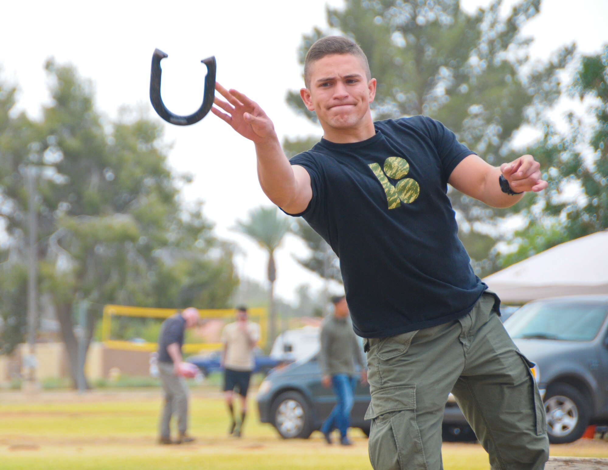 Airman Gabriel Coronado, 944th Fighter Wing Detachment 1 munitions systems apprentice, plays a game of horseshoes during the unit’s Family Day picnic May 7 at Luke Air Force Base, Ariz. Representatives from Benevilla Family Resource Center, Military One Source, and the Airman and Family Readiness Center were on-hand to provide helpful information for Citizen Airmen and their families. (U.S. Air Force photo by Tech. Sgt. Nestor Cruz)