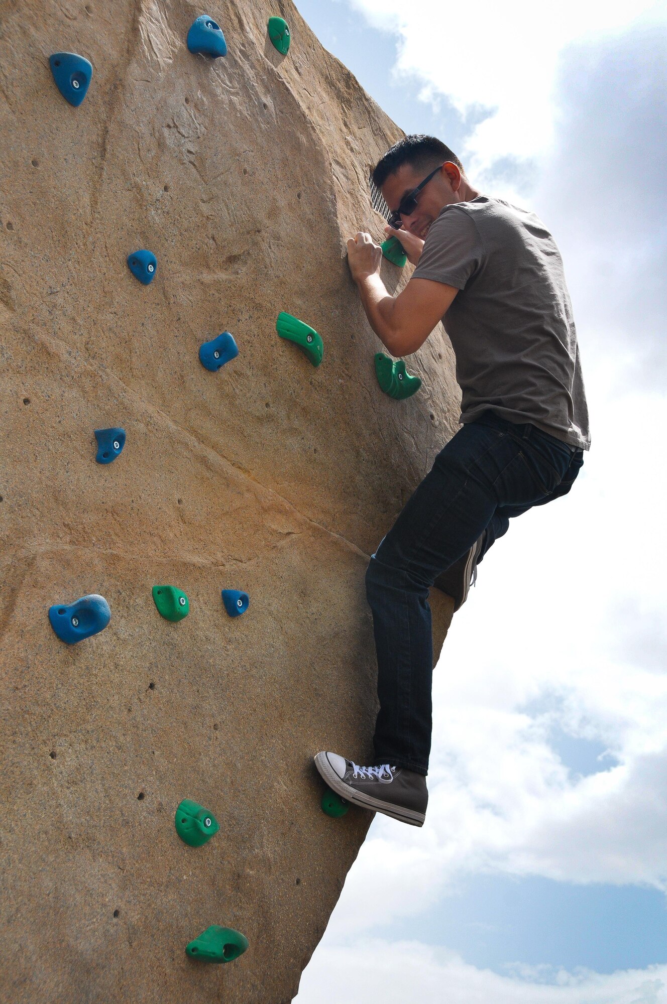 Staff Sgt. Brandon Vasquez, 944th Fighter Wing Detachment 1 aerospace propulsion technician, scales an artificial rock climbing wall during the unit’s Family Day picnic May 7 at Luke Air Force Base, Ariz. 944 FW Det. 1 Airmen and their families enjoyed food, games and music. Representatives from various agencies including Benevilla Family Resource Center, Military One Source, and the Airman and Family Readiness Center were on-hand to provide helpful information for Citizen Airmen and their families. (U.S. Air Force photo by Tech. Sgt. Nestor Cruz)