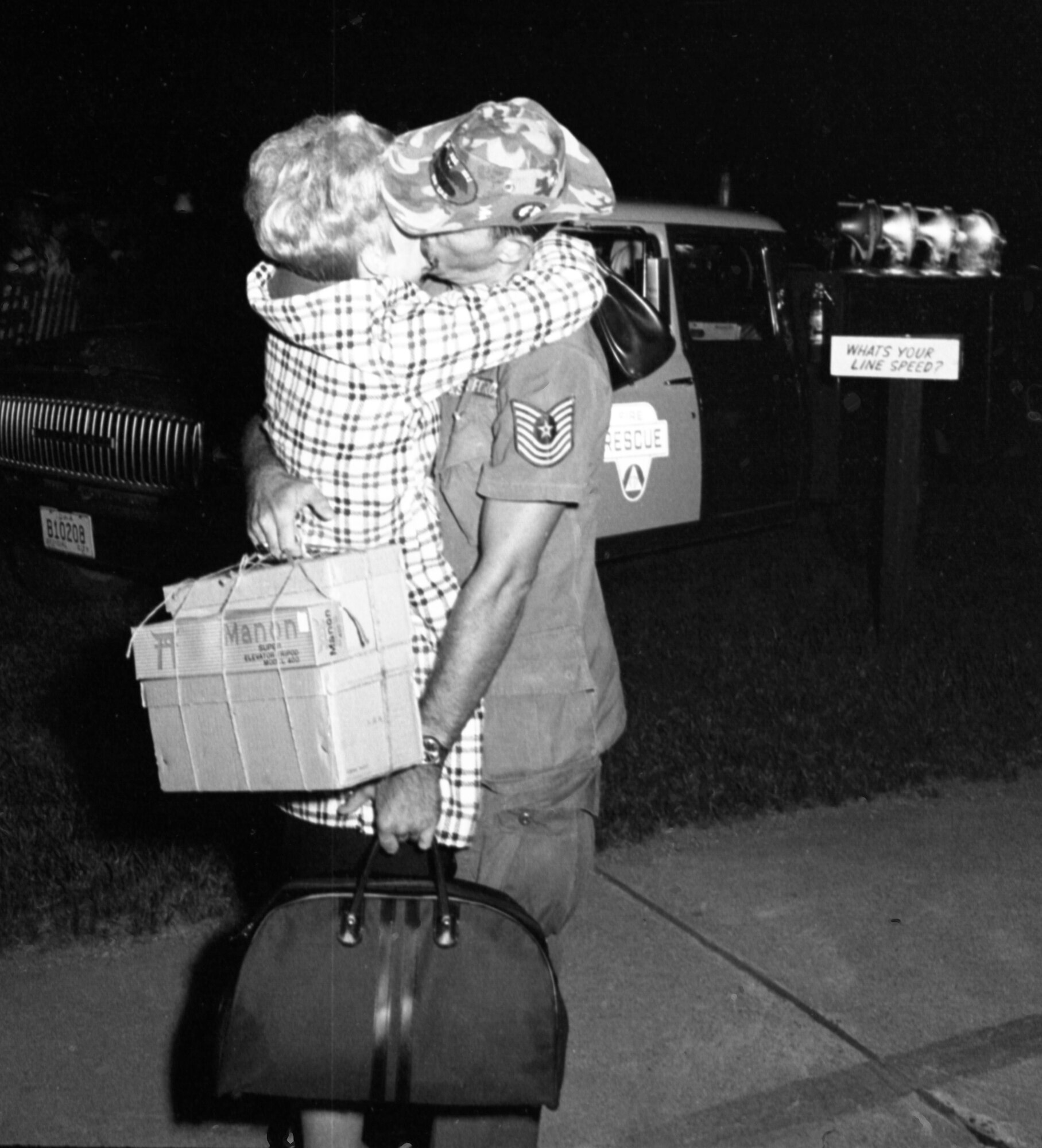 An Airman from the 185th Tactical Fighter Group hugs his wife upon returning to Sioux City, Iowa on the evening of May 14, 1969. The airman is returning from a yearlong activation to Phu Cat Airbase in South Vietnam. (U.S. Air National Guard Photo/released 185th TFG Photo)