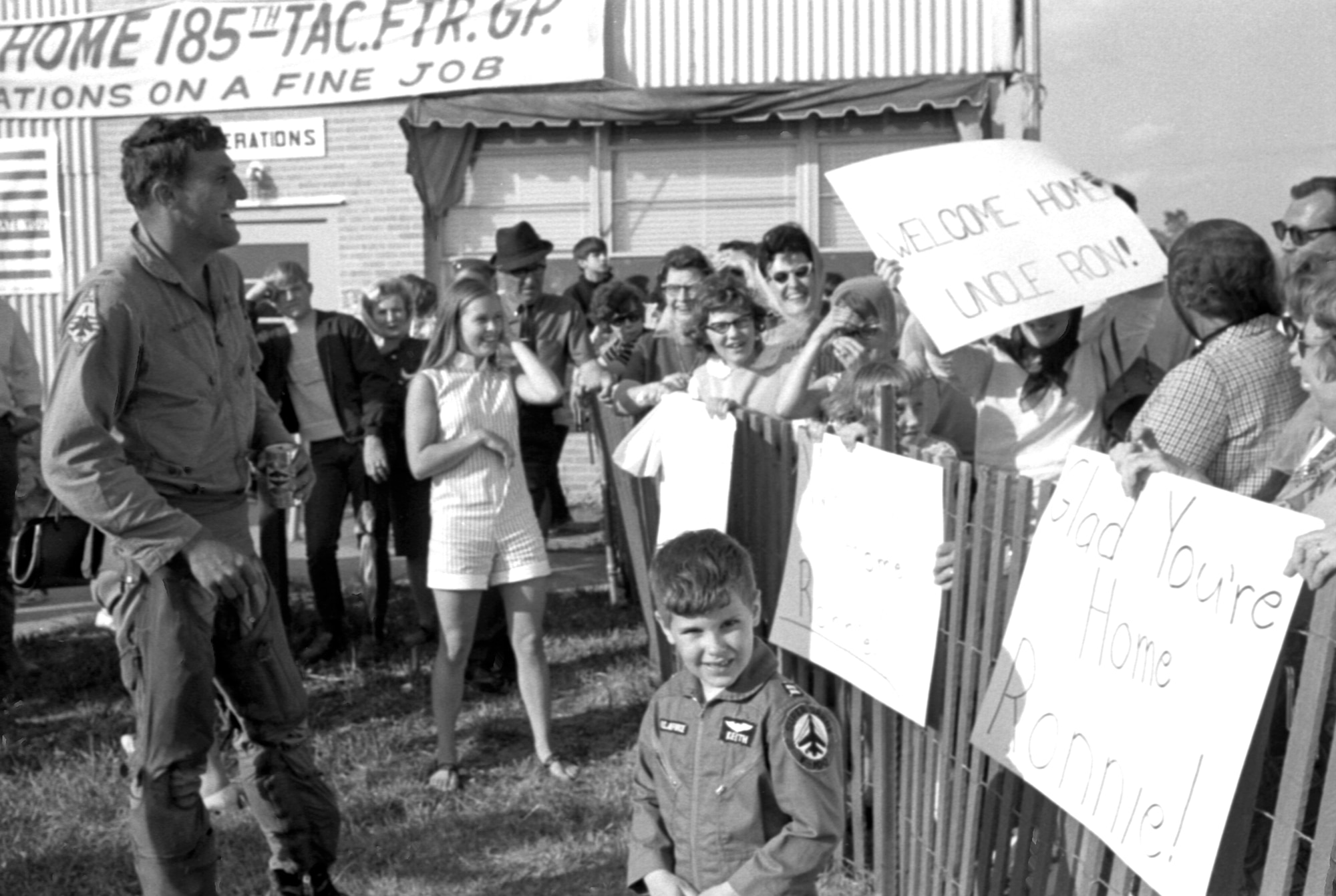 An Iowa Air National Guard, F-100 fighter pilot with the 185th Tactical Fighter Group is greeted by family and friends in Sioux City, Iowa on May 14, 1969, after returning home from a yearlong activation at Phu Cat Airbase in South Vietnam. (U.S. Air National Guard photo/released 185th TFG Photo)
