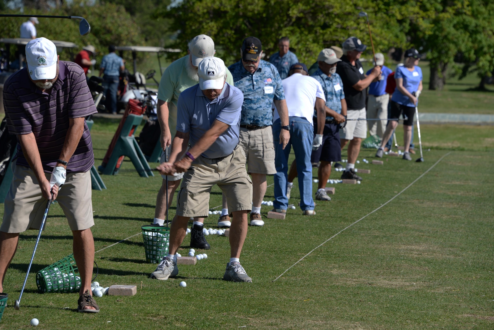 Military veterans participate in the Professional Golfers Association's Helping Our Patriots Everywhere event May 5 at the Cypress Lakes Golf Course in Vacaville, Calif. Dozens of veterans attended the event designed to teach golf skills and bring prior service members together. (U.S. Air Force photo/Tech. Sgt. James Hodgman/Released)