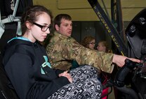 Capt. Alexander Kiel, 54th Helicopter Squadron chief of current operations, explains a helicopter’s controls at Minot Air Force Base, N.D., May 1, 2017. During the tour, Edison Elementary School’s science, technology, engineering and math girls visited a B-52H Stratofortress static display, the Missile Procedures Trainer, 5th Medical Group, 5th Civil Engineer Squadron fire station and the 54th Helicopter Squadron. (U.S. Air Force photo/Airman 1st Class Alyssa M. Akers)