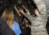 Senior Airman Joshua Suter, 5th Aircraft Maintenance Squadron crew chief, explains a B-52H Stratofortress’s landing gear during a tour at Minot Air Force Base, N.D., May 1, 2017. The 5th AMXS Airmen taught Edison Elementary School’s science, technology, engineering and math girls about the aircraft’s mission and features. (U.S. Air Force photo/Airman 1st Class Alyssa M. Akers)