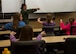1st Lt. Katelyn Woodley, 741st Missile Squadron intercontinental ballistic missile combat crew commander, teaches Edison Elementary School’s science, technology, engineering and math girls to launch a missile at the Missile Procedures Trainer on Minot Air Force Base, N.D., May 1, 2017. The STEM girls learned the basics of a missileer’s job, including the necessary procedures of a missile launch. (U.S. Air Force photo/Airman 1st Class Alyssa M. Akers)