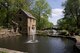 The Old Mill is located at T.R. Pugh Memorial Park at North Little Rock, Ark. The mill is a historic re-creation of an 1880's water-powered grist mill, so perfect in its construction, it was used in the opening scenes of the 1939 movie 