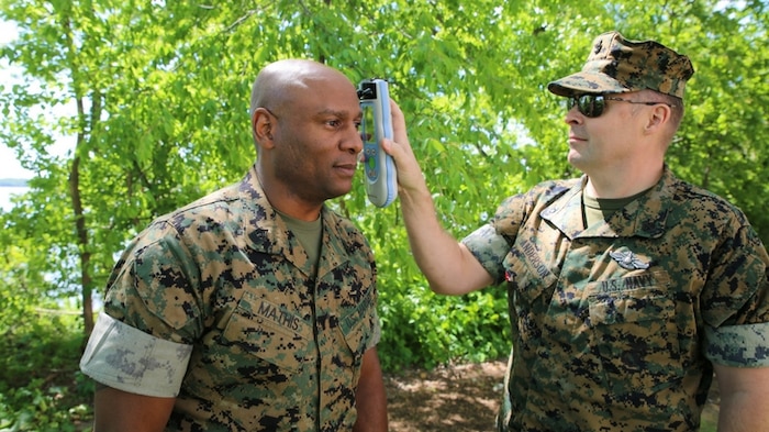 Chief Hospital Corpsman Jared Anderson uses an Infrascanner to assess Master Gunnery Sgt. Maceo Mathis for intracranial hematomas--or bleeding within the skull--aboard Marine Corps Base Quantico, Va. The Infrascanner is a portable, medical diagnostic device that provides early detection of intracranial hematomas in the field, potentially saving lives and improving casualty care and recovery. Infrascanners are available for medical personnel to use at battalion aid stations across the Corps.  (U.S. Marine Corps photo by Ashley Calingo)