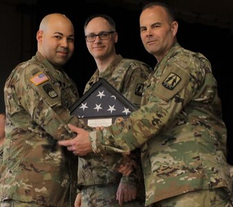 U.S. Army Command Sgt. Major Timothy Eddy, command sergeant major for the Army Reserve Cyber Operations Group (ARCOG), 335th Signal Command (Theater), congratulates a Soldier who was deployed with the ARCOG’s North Capital Region Cyber Protection Center’s, Detachment 21, during a welcome home ceremony April 2 at Fort Meade, Maryland. The Detachment was deployed to Kuwait as part of U.S. Army Central Command, to conduct cyber missions and training. (U.S. Army Reserve Photo by Sgt. Erick Yates)