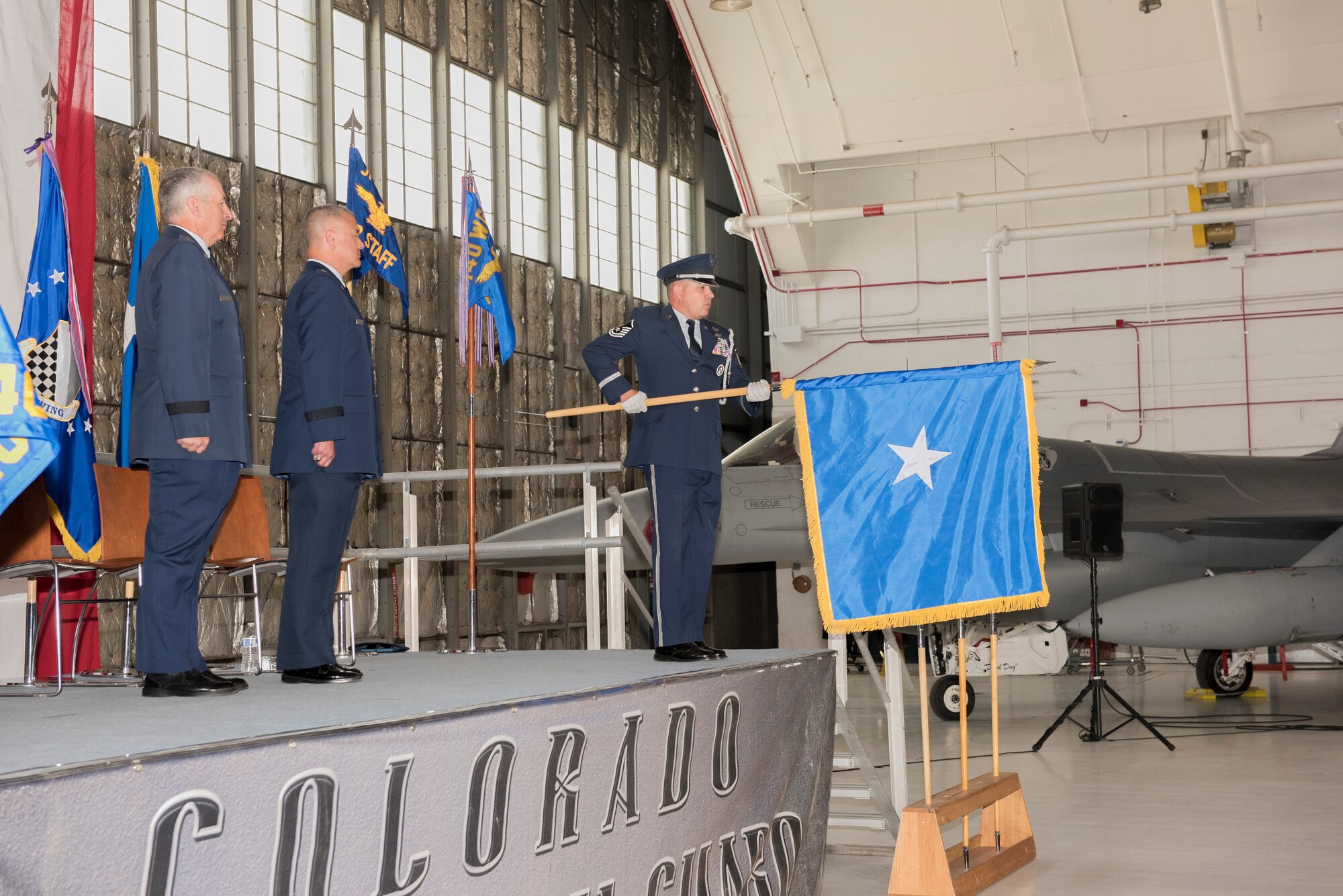 Air Force Maj. Gen. Michael Edwards, Adjutant General for the state of Colorado and Brig. Gen. Floyd Dunstan, Assistant Adjutant General, Colorado Air National Guard, stand at attention as the general officer flag is presented to Dunstan during his promotion to Brigadier General, May 6, 2017, Buckley Air Force Base, Aurora, Colo. Upon promotion to the general officer ranks, it is customary to receive a personal flag, representing authority and/or command.  (U.S. Air National Guard photo by Staff Sgt. Michelle Y. Alvarez-Rea)