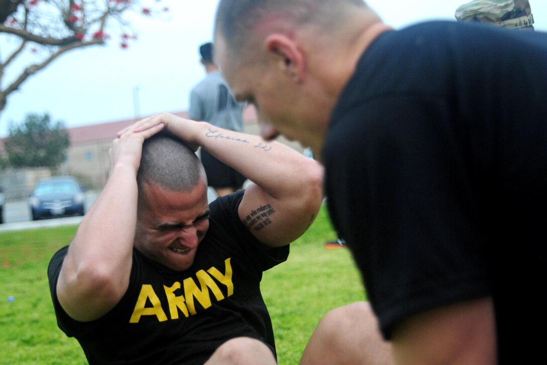 Sgt. Carlos Garcia Velasquez, a human resources specialist with the 90th Sustainment Brigade, conducts sit-ups during the Best Warrior Competition hosted by the 79th SSC at Camp Pendleton, Calif., May 4, 2017. 

The U.S. Army Reserve's 79th Sustainment Support Command hosted their 2017 Best Warrior Competition at Camp Pendleton, Calif., May 3-6. The Best Warrior Competition seeks out the best candidate that defines a U.S. Army Soldier by testing Soldiers physically and mentally. The competition consisted of one enlisted Soldier and one noncommissioned officer from four separate one-star commands, which fall underneath the command and control of 79th SSC. At the conclusion, one Soldier and one NCO were named the 79th SSC Best Warriors and will represent the command in the U.S. Army Reserve Best Warrior Competition held at Fort Bragg, N.C., June 4-10, 2017. (U.S. Army photo by Sgt. Heather Doppke/released)