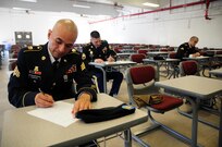 Sgt. Felix Garcia, a financial management technician with the 311th Expeditionary Sustainment Command, conducts writes an essay during the Best Warrior Competition hosted by the 79th SSC at Camp Pendleton, Calif., May 4, 2017. 

The U.S. Army Reserve's 79th Sustainment Support Command hosted their 2017 Best Warrior Competition at Camp Pendleton, Calif., May 3-6. The Best Warrior Competition seeks out the best candidate that defines a U.S. Army Soldier by testing Soldiers physically and mentally. The competition consisted of one enlisted Soldier and one noncommissioned officer from four separate one-star commands, which fall underneath the command and control of 79th SSC. At the conclusion, one Soldier and one NCO were named the 79th SSC Best Warriors and will represent the command in the U.S. Army Reserve Best Warrior Competition held at Fort Bragg, N.C., June 4-10, 2017. (U.S. Army photo by Sgt. Heather Doppke/released)