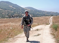 Spc. Mitchell Willyard, a human resources specialist with the 620th Combat Sustainment Support Battalion, conducts a 6.2-mile ruck march during the Best Warrior Competition hosted by the 79th SSC at Camp Pendleton, Calif., May 4, 2017. 

The U.S. Army Reserve's 79th Sustainment Support Command hosted their 2017 Best Warrior Competition at Camp Pendleton, Calif., May 3-6. The Best Warrior Competition seeks out the best candidate that defines a U.S. Army Soldier by testing Soldiers physically and mentally. The competition consisted of one enlisted Soldier and one noncommissioned officer from four separate one-star commands, which fall underneath the command and control of 79th SSC. At the conclusion, one Soldier and one NCO were named the 79th SSC Best Warriors and will represent the command in the U.S. Army Reserve Best Warrior Competition held at Fort Bragg, N.C., June 4-10, 2017. (U.S. Army photo by Sgt. Heather Doppke/released)