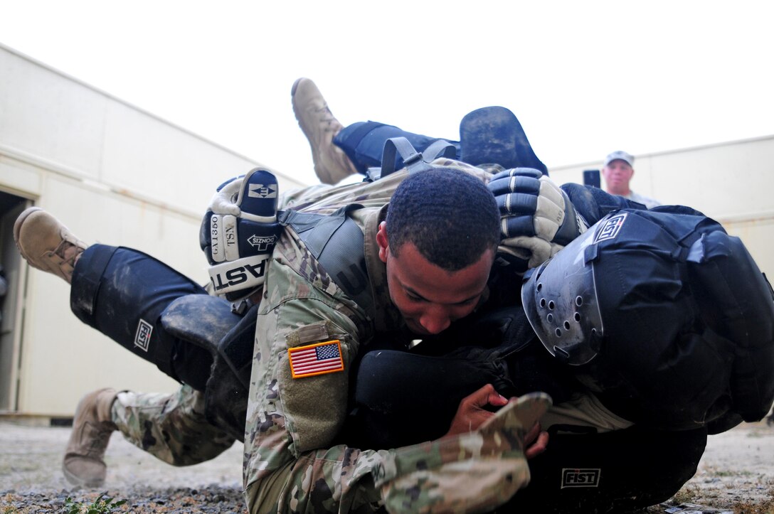 Spc. Charles Cherry, a paralegal specialist with the 79th Sustainment Support Command, subdues a "high value target" during the Best Warrior Competition hosted by the 79th SSC at Camp Pendleton, Calif., May 5, 2017. 

The U.S. Army Reserve's 79th Sustainment Support Command hosted their 2017 Best Warrior Competition at Camp Pendleton, Calif., May 3-6. The Best Warrior Competition seeks out the best candidate that defines a U.S. Army Soldier by testing Soldiers physically and mentally. The competition consisted of one enlisted Soldier and one noncommissioned officer from four separate one-star commands, which fall underneath the command and control of 79th SSC. At the conclusion, one Soldier and one NCO were named the 79th SSC Best Warriors and will represent the command in the U.S. Army Reserve Best Warrior Competition held at Fort Bragg, N.C., June 4-10, 2017. (U.S. Army photo by Sgt. Heather Doppke/released)