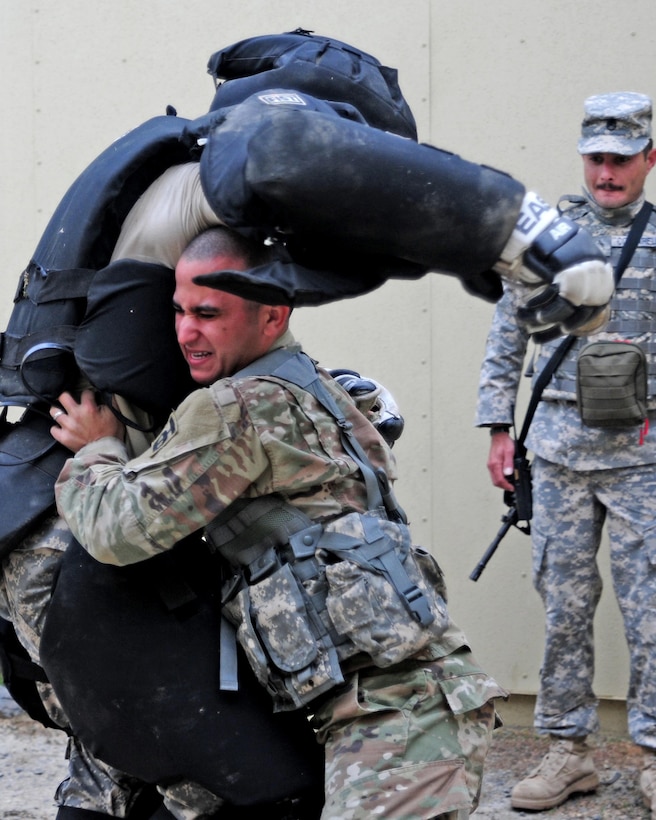 Sgt. Carlos Garcia Velasquez, a human resources specialist with the 90th Sustainment Brigade, subdues a "high value target" during the Best Warrior Competition hosted by the 79th SSC at Camp Pendleton, Calif., May 5, 2017. 

The U.S. Army Reserve's 79th Sustainment Support Command hosted their 2017 Best Warrior Competition at Camp Pendleton, Calif., May 3-6. The Best Warrior Competition seeks out the best candidate that defines a U.S. Army Soldier by testing Soldiers physically and mentally. The competition consisted of one enlisted Soldier and one noncommissioned officer from four separate one-star commands, which fall underneath the command and control of 79th SSC. At the conclusion, one Soldier and one NCO were named the 79th SSC Best Warriors and will represent the command in the U.S. Army Reserve Best Warrior Competition held at Fort Bragg, N.C., June 4-10, 2017. (U.S. Army photo by Sgt. Heather Doppke/released)