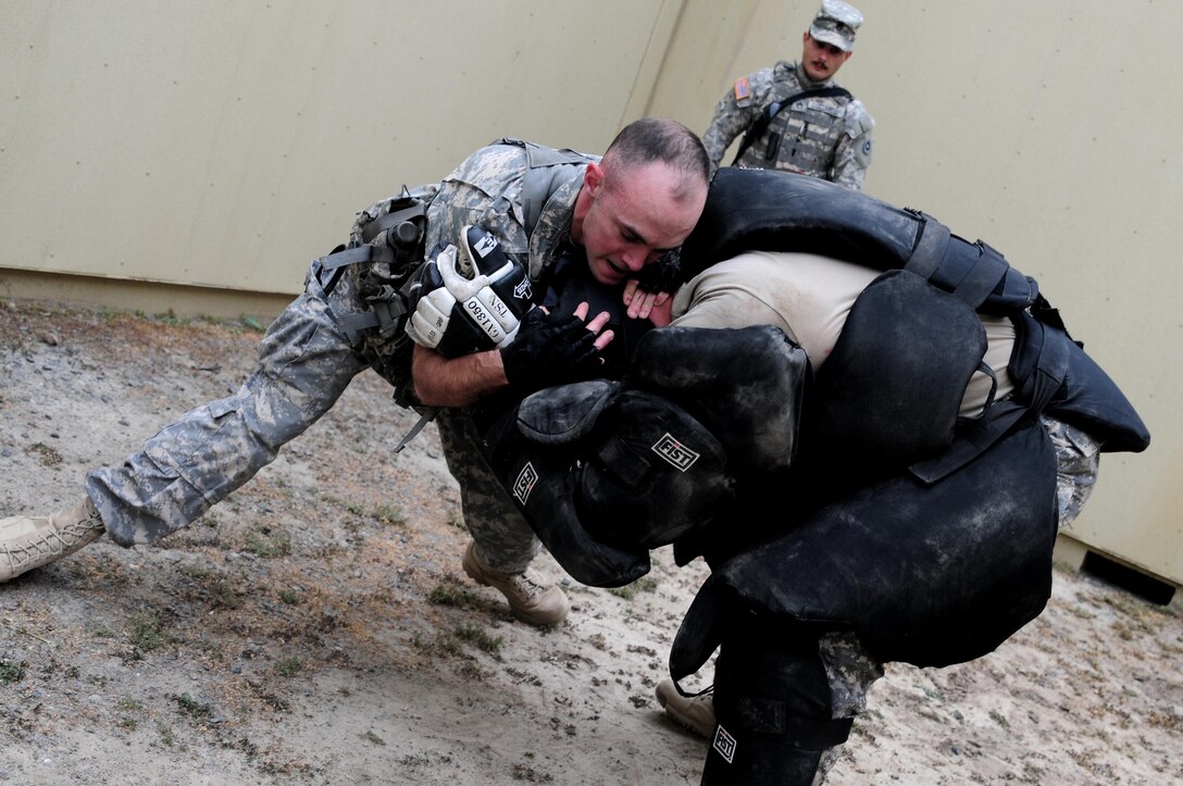 Spc. Justin Rafferty, a petroleum supply specialist with the 910th Quartermaster Company, subdues a "high value target" during the Best Warrior Competition hosted by the 79th SSC at Camp Pendleton, Calif., May 5, 2017. 

The U.S. Army Reserve's 79th Sustainment Support Command hosted their 2017 Best Warrior Competition at Camp Pendleton, Calif., May 3-6. The Best Warrior Competition seeks out the best candidate that defines a U.S. Army Soldier by testing Soldiers physically and mentally. The competition consisted of one enlisted Soldier and one noncommissioned officer from four separate one-star commands, which fall underneath the command and control of 79th SSC. At the conclusion, one Soldier and one NCO were named the 79th SSC Best Warriors and will represent the command in the U.S. Army Reserve Best Warrior Competition held at Fort Bragg, N.C., June 4-10, 2017. (U.S. Army photo by Sgt. Heather Doppke/released)