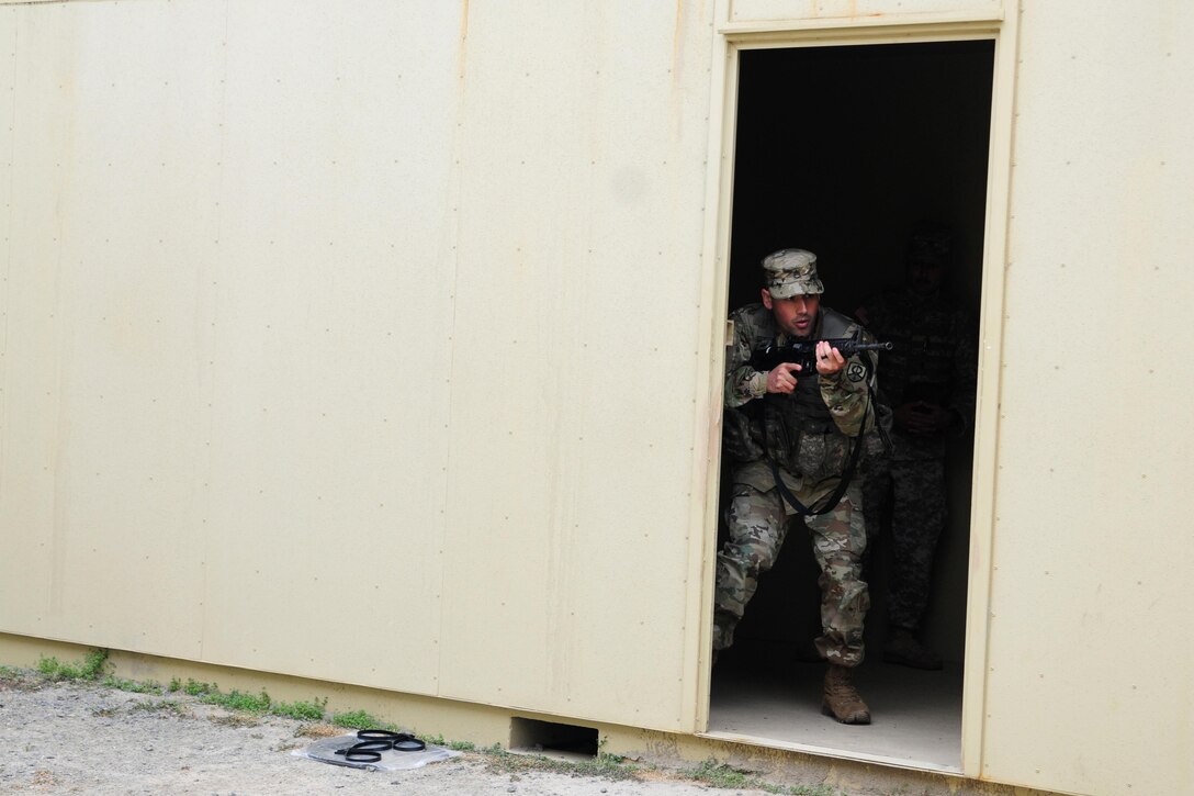 Staff Sgt. Kenneth Chefan, a transportation management coordinator with the 535th Movement Control Team, enters and clears rooms during the Best Warrior Competition hosted by the 79th SSC at Camp Pendleton, Calif., May 5, 2017. 

The U.S. Army Reserve's 79th Sustainment Support Command hosted their 2017 Best Warrior Competition at Camp Pendleton, Calif., May 3-6. The Best Warrior Competition seeks out the best candidate that defines a U.S. Army Soldier by testing Soldiers physically and mentally. The competition consisted of one enlisted Soldier and one noncommissioned officer from four separate one-star commands, which fall underneath the command and control of 79th SSC. At the conclusion, Chetan was named one of the 79th SSC Best Warriors and will represent the command in the U.S. Army Reserve Best Warrior Competition held at Fort Bragg, N.C., June 4-10, 2017. (U.S. Army photo by Sgt. Heather Doppke/released)