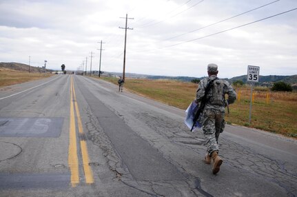 Spc. Kenny Ochoa, a watercraft operator with the 481st Transportation Company, runs down the road during the Land Navigation Course portion of the Best Warrior Competition hosted by the 79th SSC at Camp Pendleton, Calif., May 6, 2017. 

The U.S. Army Reserve's 79th Sustainment Support Command hosted their 2017 Best Warrior Competition at Camp Pendleton, Calif., May 3-6. The Best Warrior Competition seeks out the best candidate that defines a U.S. Army Soldier by testing Soldiers physically and mentally. The competition consisted of one enlisted Soldier and one noncommissioned officer from four separate one-star commands, which fall underneath the command and control of 79th SSC. At the conclusion, Ochoa was named one of the 79th SSC Best Warriors and will represent the command in the U.S. Army Reserve Best Warrior Competition held at Fort Bragg, N.C., June 4-10, 2017. (U.S. Army photo by Sgt. Heather Doppke/released)