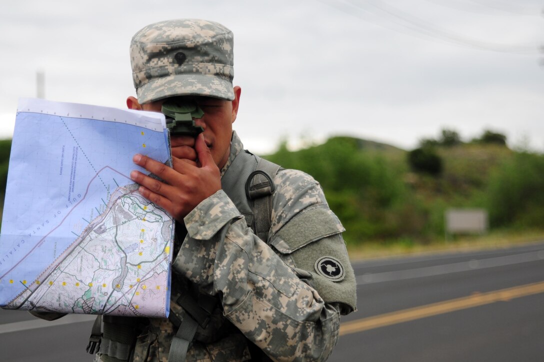 Spc. Kenny Ochoa, a watercraft operator with the 481st Transportation Company, shoots his azimuth during the Land Navigation Course portion of the Best Warrior Competition hosted by the 79th SSC at Camp Pendleton, Calif., May 6, 2017. 

The U.S. Army Reserve's 79th Sustainment Support Command hosted their 2017 Best Warrior Competition at Camp Pendleton, Calif., May 3-6. The Best Warrior Competition seeks out the best candidate that defines a U.S. Army Soldier by testing Soldiers physically and mentally. The competition consisted of one enlisted Soldier and one noncommissioned officer from four separate one-star commands, which fall underneath the command and control of 79th SSC. At the conclusion, Ochoa was named one of the 79th SSC Best Warriors and will represent the command in the U.S. Army Reserve Best Warrior Competition held at Fort Bragg, N.C., June 4-10, 2017. (U.S. Army photo by Sgt. Heather Doppke/released)