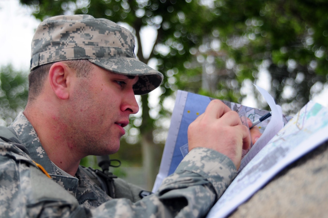 Spc. Daniel Kovitch, a motor transport operator with the 364th Expeditionary Sustainment Command, plots points on a map during the Land Navigation Course portion of the Best Warrior Competition hosted by the 79th SSC at Camp Pendleton, Calif., May 6, 2017. 

The U.S. Army Reserve's 79th Sustainment Support Command hosted their 2017 Best Warrior Competition at Camp Pendleton, Calif., May 3-6. The Best Warrior Competition seeks out the best candidate that defines a U.S. Army Soldier by testing Soldiers physically and mentally. The competition consisted of one enlisted Soldier and one noncommissioned officer from four separate one-star commands, which fall underneath the command and control of 79th SSC. At the conclusion, one Soldier and one NCO were named the 79th SSC Best Warriors and will represent the command in the U.S. Army Reserve Best Warrior Competition held at Fort Bragg, N.C., June 4-10, 2017. (U.S. Army photo by Sgt. Heather Doppke/released)