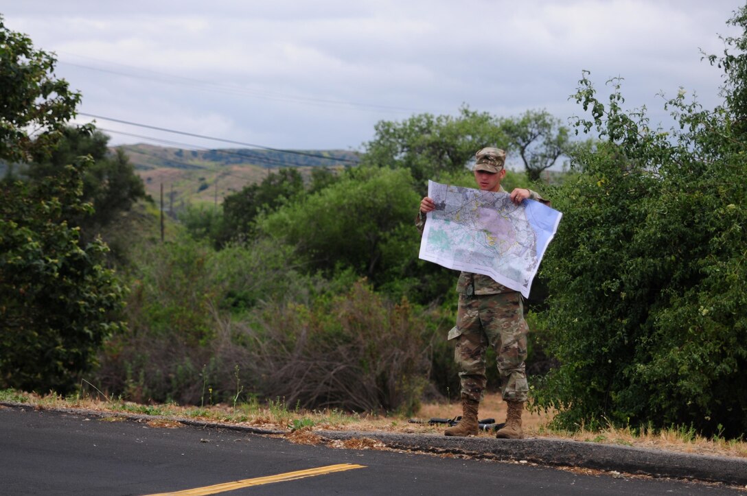 Sgt. Carlos Garcia Velasquez, a human resources specialist with the 90th Sustainment Brigade, looks at a map during the Land Navigation Course portion of the Best Warrior Competition hosted by the 79th SSC at Camp Pendleton, Calif., May 6, 2017. 

The U.S. Army Reserve's 79th Sustainment Support Command hosted their 2017 Best Warrior Competition at Camp Pendleton, Calif., May 3-6. The Best Warrior Competition seeks out the best candidate that defines a U.S. Army Soldier by testing Soldiers physically and mentally. The competition consisted of one enlisted Soldier and one noncommissioned officer from four separate one-star commands, which fall underneath the command and control of 79th SSC. At the conclusion, one Soldier and one NCO were named the 79th SSC Best Warriors and will represent the command in the U.S. Army Reserve Best Warrior Competition held at Fort Bragg, N.C., June 4-10, 2017. (U.S. Army photo by Sgt. Heather Doppke/released)