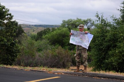 Sgt. Carlos Garcia Velasquez, a human resources specialist with the 90th Sustainment Brigade, looks at a map during the Land Navigation Course portion of the Best Warrior Competition hosted by the 79th SSC at Camp Pendleton, Calif., May 6, 2017. 

The U.S. Army Reserve's 79th Sustainment Support Command hosted their 2017 Best Warrior Competition at Camp Pendleton, Calif., May 3-6. The Best Warrior Competition seeks out the best candidate that defines a U.S. Army Soldier by testing Soldiers physically and mentally. The competition consisted of one enlisted Soldier and one noncommissioned officer from four separate one-star commands, which fall underneath the command and control of 79th SSC. At the conclusion, one Soldier and one NCO were named the 79th SSC Best Warriors and will represent the command in the U.S. Army Reserve Best Warrior Competition held at Fort Bragg, N.C., June 4-10, 2017. (U.S. Army photo by Sgt. Heather Doppke/released)