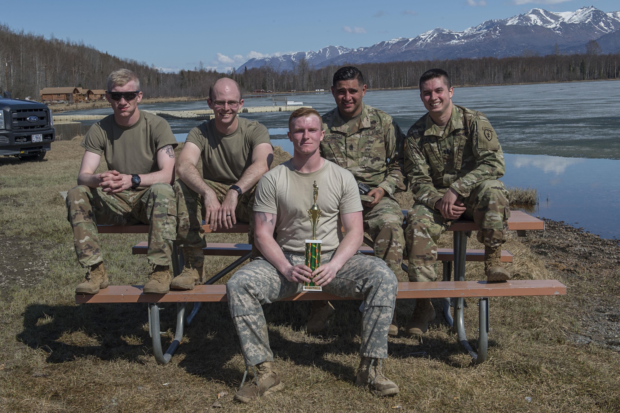 Joint Base Elmendorf-Richardson service members participate in the Combat Cross Country Trail Run at Otter Lake, JBER, Alaska, May 5, 2017. During the event, nine teams of five ran approximately three miles around the lake with 35-pound ruck-sacks. The team representing the 4th Quartermaster Company, 725th Brigade Support Battalion (Airborne), 4th Infantry Brigade Combat Team (Airborne), 25th Infantry Division, U.S. Army Alaska, received first place. 
