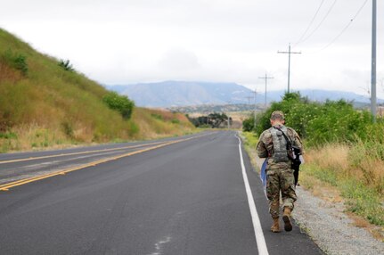 Sgt. Carlos Garcia Velasquez, a human resources specialist with the 90th Sustainment Brigade, hikes down a road during the Land Navigation Course portion of the Best Warrior Competition hosted by the 79th SSC at Camp Pendleton, Calif., May 6, 2017.

The U.S. Army Reserve's 79th Sustainment Support Command hosted their 2017 Best Warrior Competition at Camp Pendleton, Calif., May 3-6. The Best Warrior Competition seeks out the best candidate that defines a U.S. Army Soldier by testing Soldiers physically and mentally. The competition consisted of one enlisted Soldier and one noncommissioned officer from four separate one-star commands, which fall underneath the command and control of 79th SSC. At the conclusion, one Soldier and one NCO were named the 79th SSC Best Warriors and will represent the command in the U.S. Army Reserve Best Warrior Competition held at Fort Bragg, N.C., June 4-10, 2017. (U.S. Army photo by Sgt. Heather Doppke/released)