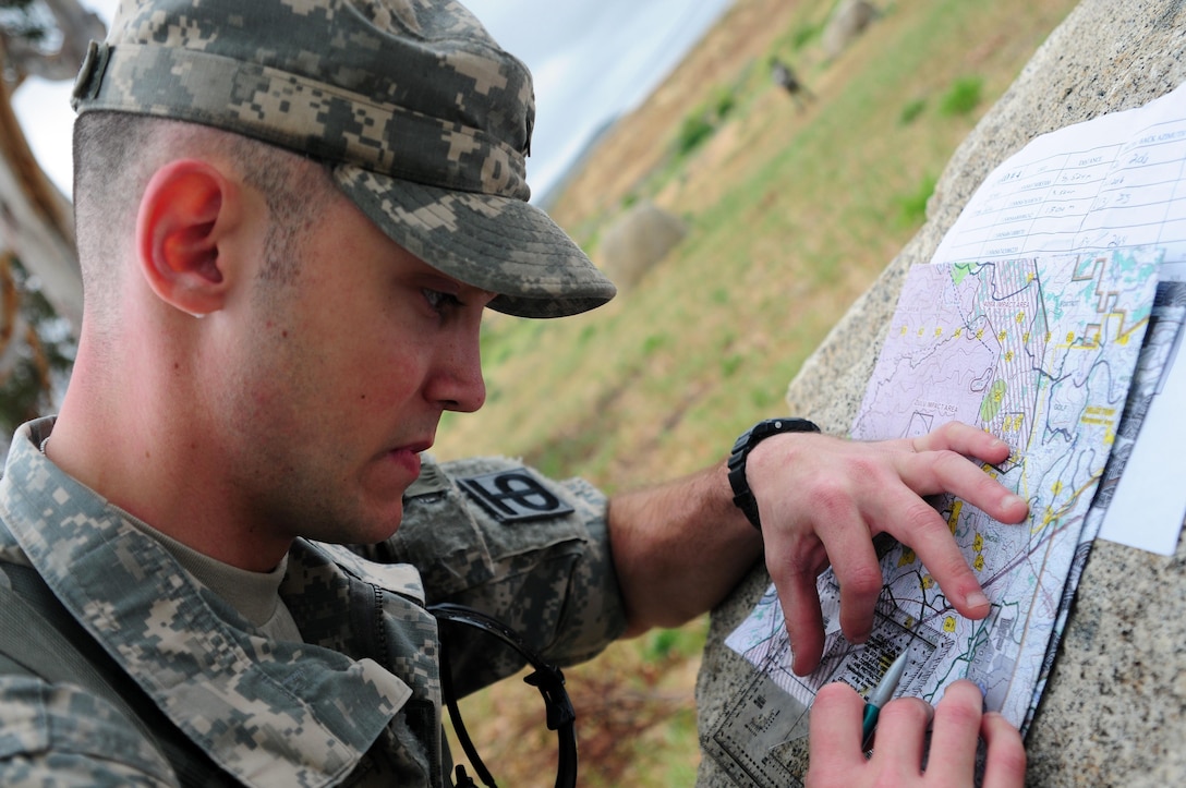 Spc. Justin Rafferty, a petroleum supply specialist with the 910th Quartermaster Company, plot points on a map during the Land Navigation Course portion of the Best Warrior Competition hosted by the 79th SSC at Camp Pendleton, Calif., May 6, 2017. 

The U.S. Army Reserve's 79th Sustainment Support Command hosted their 2017 Best Warrior Competition at Camp Pendleton, Calif., May 3-6. The Best Warrior Competition seeks out the best candidate that defines a U.S. Army Soldier by testing Soldiers physically and mentally. The competition consisted of one enlisted Soldier and one noncommissioned officer from four separate one-star commands, which fall underneath the command and control of 79th SSC. At the conclusion, one Soldier and one NCO were named the 79th SSC Best Warriors and will represent the command in the U.S. Army Reserve Best Warrior Competition held at Fort Bragg, N.C., June 4-10, 2017. (U.S. Army photo by Sgt. Heather Doppke/released)