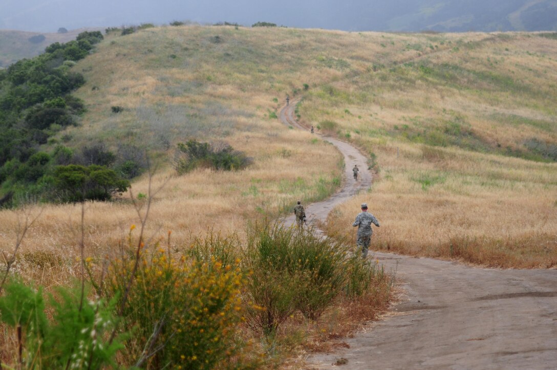 U.S. Army Reserve Soldiers run down a dirt path during the 5k challenge event of the Best Warrior Competition hosted by the 79th SSC at Camp Pendleton, Calif., May 6, 2017. 

The U.S. Army Reserve's 79th Sustainment Support Command hosted their 2017 Best Warrior Competition at Camp Pendleton, Calif., May 3-6. The Best Warrior Competition seeks out the best candidate that defines a U.S. Army Soldier by testing Soldiers physically and mentally. The competition consisted of one enlisted Soldier and one noncommissioned officer from four separate one-star commands, which fall underneath the command and control of 79th SSC. At the conclusion, one Soldier and one NCO were named the 79th SSC Best Warriors and will represent the command in the U.S. Army Reserve Best Warrior Competition held at Fort Bragg, N.C., June 4-10, 2017. (U.S. Army photo by Sgt. Heather Doppke/released)