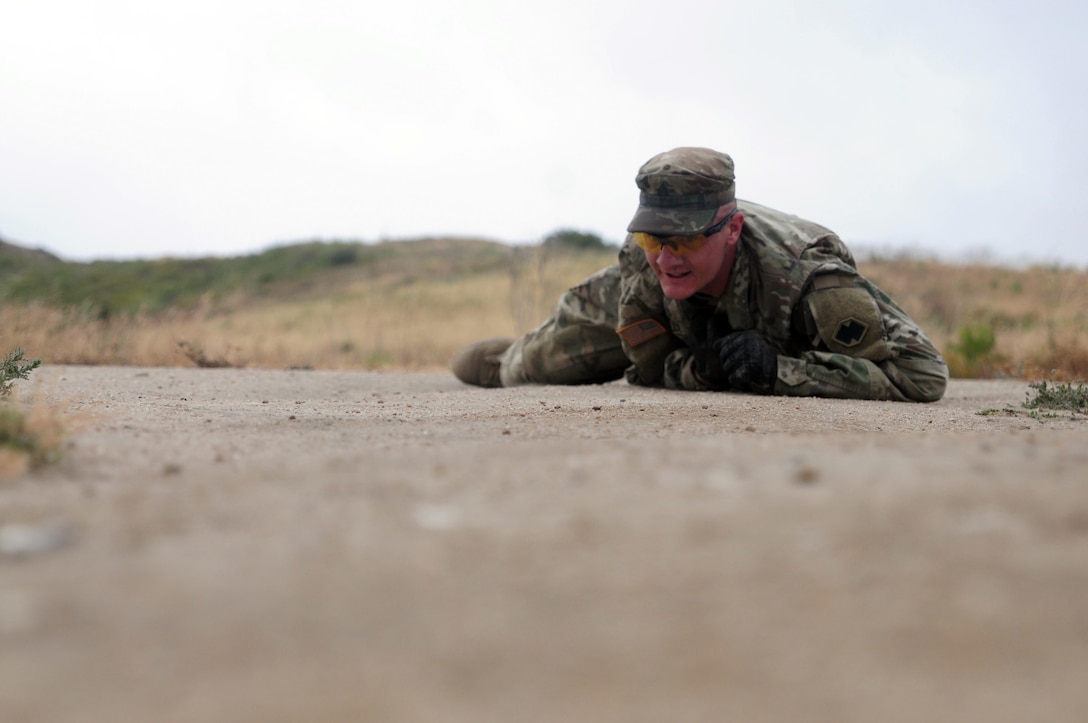Sgt. Brandon Blue, a horizontal construction engineer with the 786th Quartermaster Company, high crawls during the 5k challenge event of the Best Warrior Competition hosted by the 79th SSC at Camp Pendleton, Calif., May 6, 2017. 

The U.S. Army Reserve's 79th Sustainment Support Command hosted their 2017 Best Warrior Competition at Camp Pendleton, Calif., May 3-6. The Best Warrior Competition seeks out the best candidate that defines a U.S. Army Soldier by testing Soldiers physically and mentally. The competition consisted of one enlisted Soldier and one noncommissioned officer from four separate one-star commands, which fall underneath the command and control of 79th SSC. At the conclusion, one Soldier and one NCO were named the 79th SSC Best Warriors and will represent the command in the U.S. Army Reserve Best Warrior Competition held at Fort Bragg, N.C., June 4-10, 2017. (U.S. Army photo by Sgt. Heather Doppke/released)