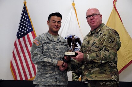 Spc. Kenny Ochoa, a watercraft operator with the 481st Transportation Company, is awarded by Command Sgt. Maj. Donald E. Langworthy II, interim command sergeant major of the 79th Sustainment Support, during the BWC’s closing ceremony hosted by the 79th SSC at Camp Pendleton, Calif., May 6, 2017.

The U.S. Army Reserve's 79th Sustainment Support Command hosted their 2017 Best Warrior Competition at Camp Pendleton, Calif., May 3-6. The Best Warrior Competition seeks out the best candidate that defines a U.S. Army Soldier by testing Soldiers physically and mentally. The competition consisted of one enlisted Soldier and one noncommissioned officer from four separate one-star commands, which fall underneath the command and control of 79th SSC. At the conclusion, Ochoa was named one of the 79th SSC Best Warriors and will represent the command in the U.S. Army Reserve Best Warrior Competition held at Fort Bragg, N.C., June 4-10, 2017. (U.S. Army photo by Sgt. Heather Doppke/released)