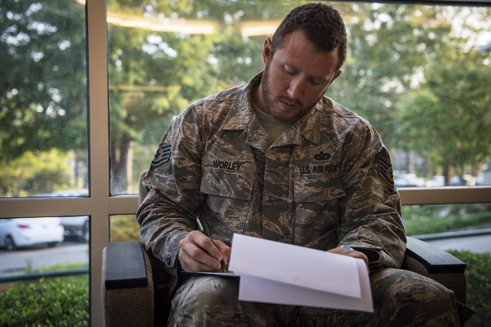 Staff Sgt. Nicholas Worley, 23d Civil Engineer Squadron electrical systems craftsman, fills out paperwork before a doctor’s appointment, April 18, 2017, in Valdosta, Ga. In January 2012 Worley was diagnosed with Chronic Myelogenous Leukemia, an uncommon form of blood-cell cancer that starts in the blood-forming bone marrow cells. He’s currently in remission and goes to the cancer center every three months to ensure his treatment is still working. (U.S. Air Force Photo by Senior Airman Janiqua P. Robinson)