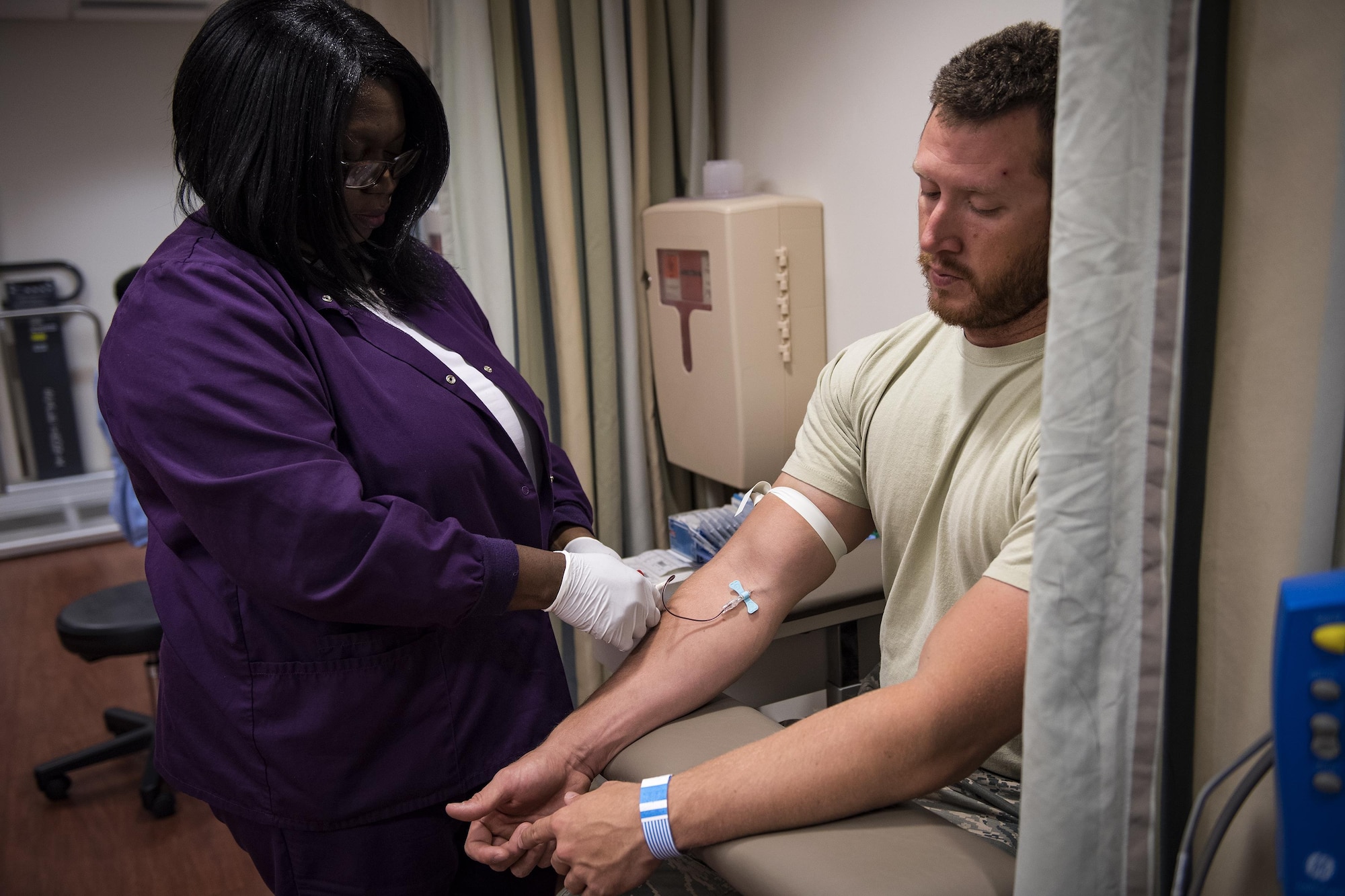 A medical assistant draws blood from Staff Sgt. Nicholas Worley, 23d Civil Engineer Squadron electrical systems craftsman, during an appointment, April 18, 2017, in Valdosta, Ga. In January 2012 Worley was diagnosed with Chronic Myelogenous Leukemia, an uncommon form of blood-cell cancer that starts in the blood-forming bone marrow cells. He’s currently in remission and goes to the cancer center every three months to ensure his treatment is still working. (U.S. Air Force Photo by Senior Airman Janiqua P. Robinson)