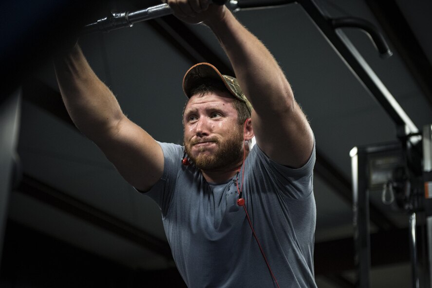 Staff Sgt. Nicholas Worley, 23d Civil Engineer Squadron electrical systems craftsman, pauses during a workout, April 18, 2017, in Valdosta, Ga. In January 2012 Worley was diagnosed with Chronic Myelogenous Leukemia, an uncommon form of blood-cell cancer that starts in the blood-forming bone marrow cells. He’s currently in remission and goes to the cancer center every three months to ensure his treatment is still working. “The gym plays a major part in my remission status because I can see my body progressing and getting stronger and I know I’m not feeling sick,” said Worley.  (U.S. Air Force Photo by Senior Airman Janiqua P. Robinson)