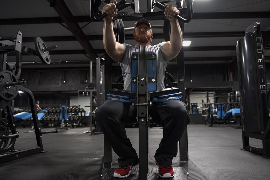 Staff Sgt. Nicholas Worley, 23d Civil Engineer Squadron electrical systems craftsman, works out, April 18, 2017, in Valdosta, Ga. In January 2012 Worley was diagnosed with Chronic Myelogenous Leukemia, an uncommon form of blood-cell cancer that starts in the blood-forming bone marrow cells. He’s currently in remission and goes to the cancer center every three months to ensure his treatment is still working. 
“The gym plays a major part in my remission status because I can see my body progressing and getting stronger and I know I’m not feeling sick,” said Worley. (U.S. Air Force Photo by Senior Airman Janiqua P. Robinson)
