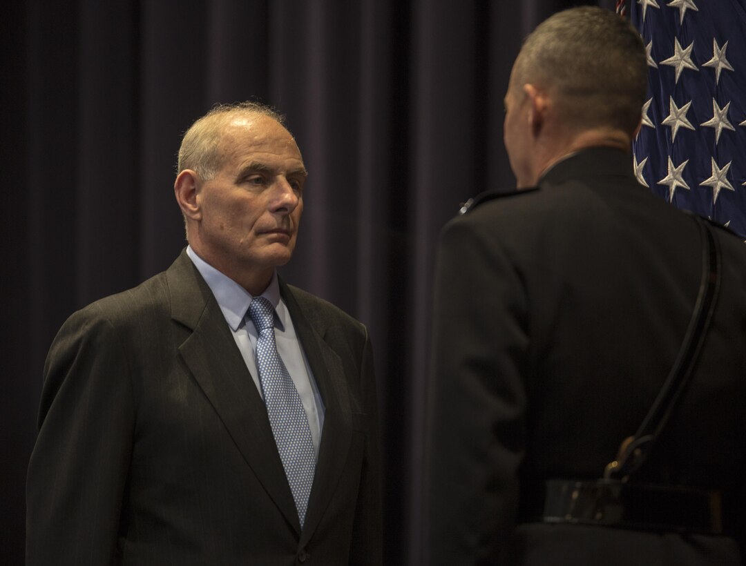 Secretary of Homeland Security, John F. Kelly, prepares to present Lt. Gen. Robert R. Ruark with an award during a retirement ceremony for Ruark at Marine Barracks Washington D.C., May 10, 2017. Ruark most recently served as the Director for Logistics, J-4, Joint Staff, and is retiring after 36 years of devoted service in the U.S. Marine Corps. (Official Marine Corps photo by Lance Cpl. Damon Mclean/Released)