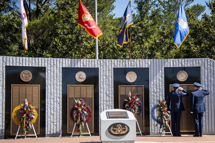 Chief Master Sgt. Martin Cortez and Lt. Col. Emil Rebik salute the list of fallen Air Force explosive ordnance disposal technicians during the 48th Annual EOD Memorial Service at the Kauffman EOD Training Complex on Eglin Air Force Base, Fla., May 6, 2017. Air Force photo by Samuel King Jr.