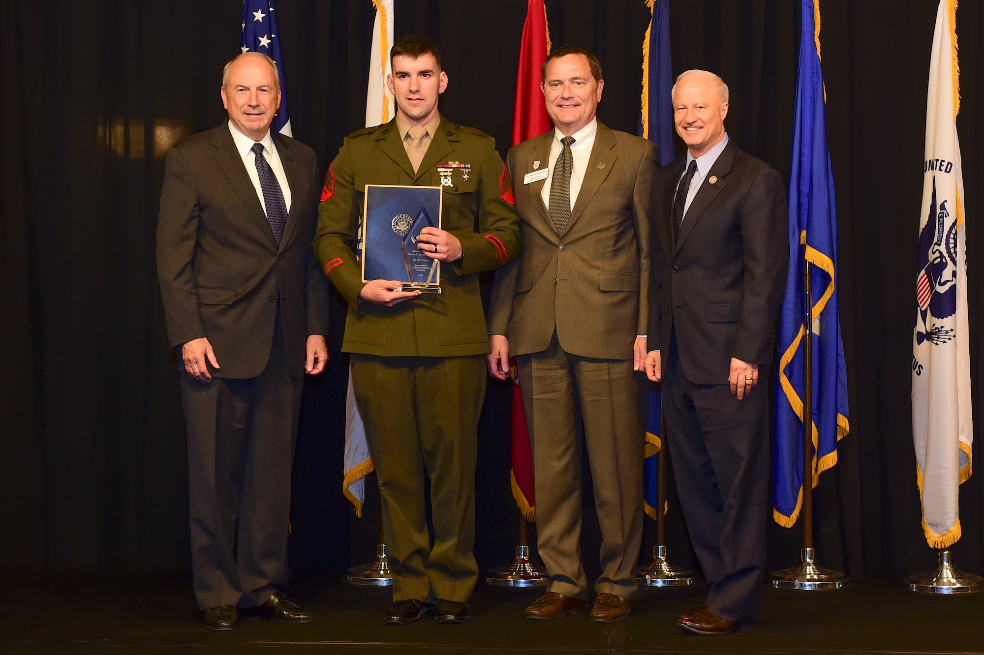 Sgt. Ray Gregory is awarded the active-duty Marine of the year at the Armed Forces Recognition Luncheon May 5, 2017, at the DoubleTree by Hilton in Denver. The AFRL is an annual event hosted by the Aurora Chamber of Commerce in appreciation of Colorado’s active-duty, guardsmen and reservists. (U.S. Air Force photo by Airman Jacob Deatherage/Released) 