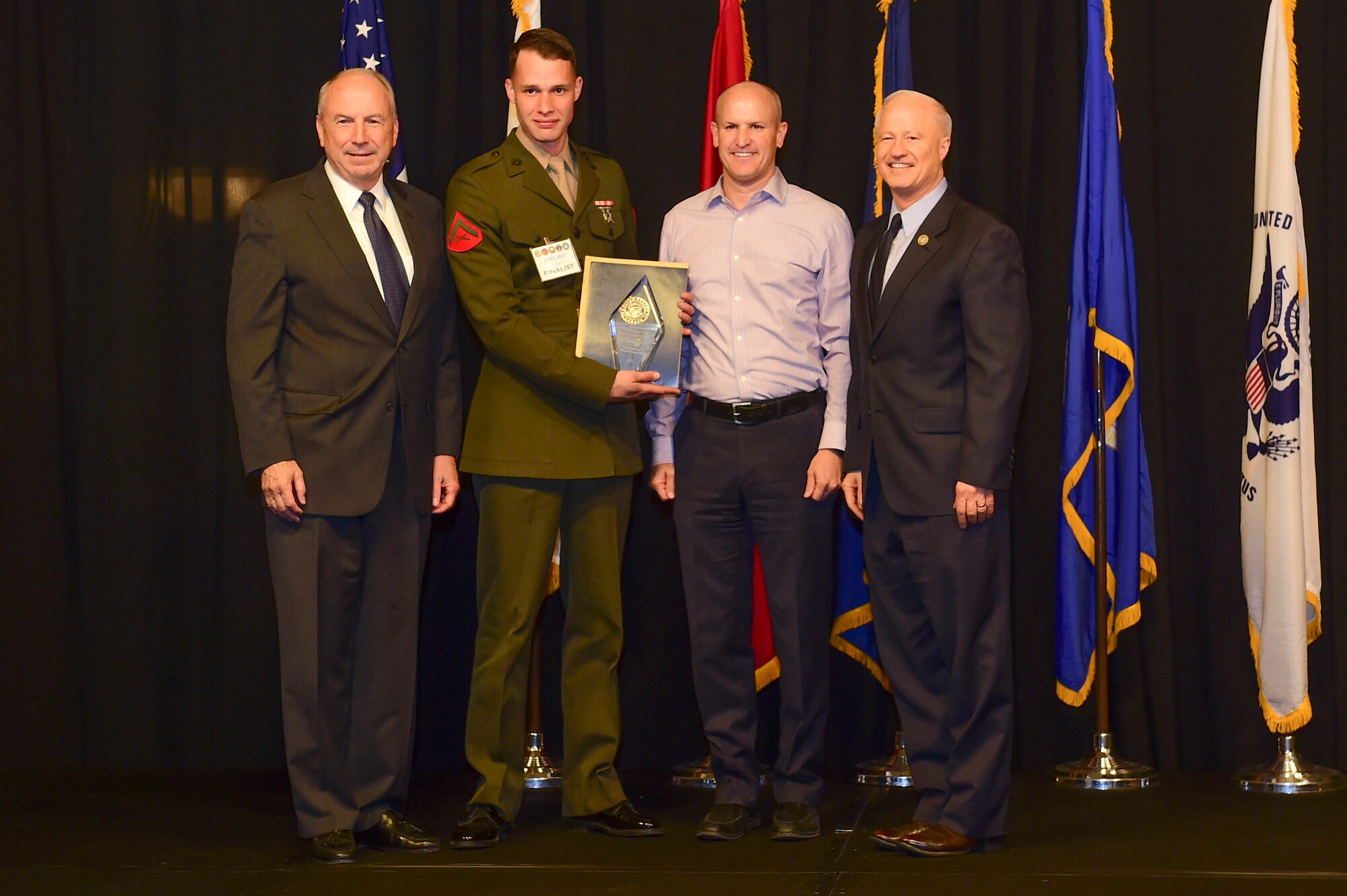 Lance Cpl. Matthew Nahmensen is awarded the Marine reservist of the year at the Armed Forces Recognition Luncheon May 5, 2017, at the DoubleTree by Hilton in Denver. The AFRL is an annual event hosted by the Aurora Chamber of Commerce in appreciation of Colorado’s active-duty, guardsmen and reservists. (U.S. Air Force photo by Airman Jacob Deatherage/Released)