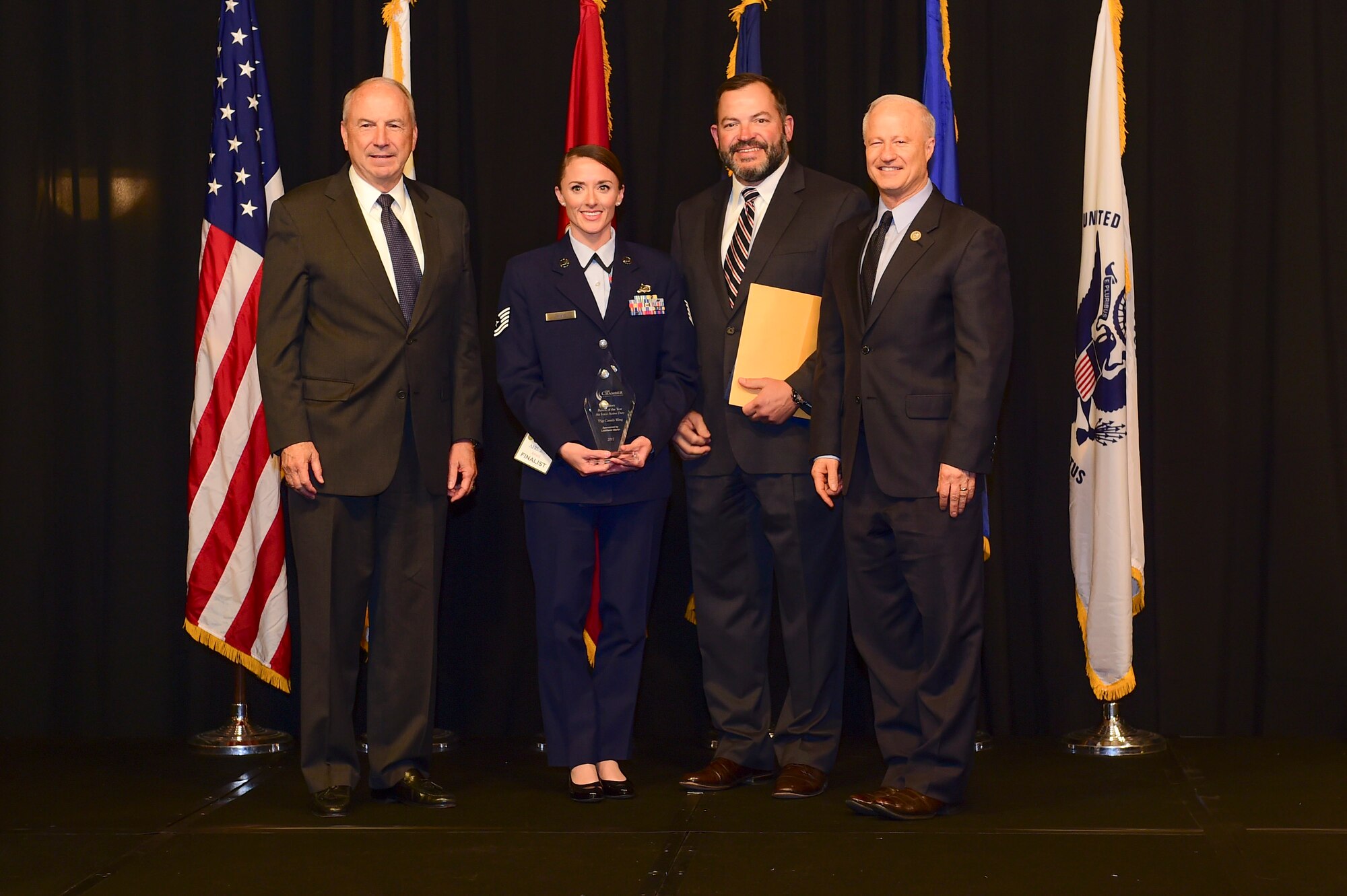 Tech. Sgt. Cassidy Wong is awarded the active-duty Airman of the year at the Armed Forces Recognition Luncheon May 5, 2017, at the DoubleTree by Hilton in Denver. The AFRL is an annual event hosted by the Aurora Chamber of Commerce in appreciation of Colorado’s active-duty, guardsmen and reservists. (U.S. Air Force photo by Airman Jacob Deatherage/Released)