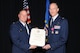 Col. James DeVere, 302nd Airlift Wing commander, presents Col. Jeffrey Higgins with a retirement certificate during his retirement ceremony May 6, 2017, at Peterson Air Force Base, Colo. Higgins retired from the 302nd Maintenance Group commander position where he led approximately 400 Citizen Airmen. During Higgins’ 30-year Air Force career, he served in  aircraft maintenance, logistics readiness and acquisition career fields. (U.S. Air Force photo/Staff Sgt. Amber Sorsek)