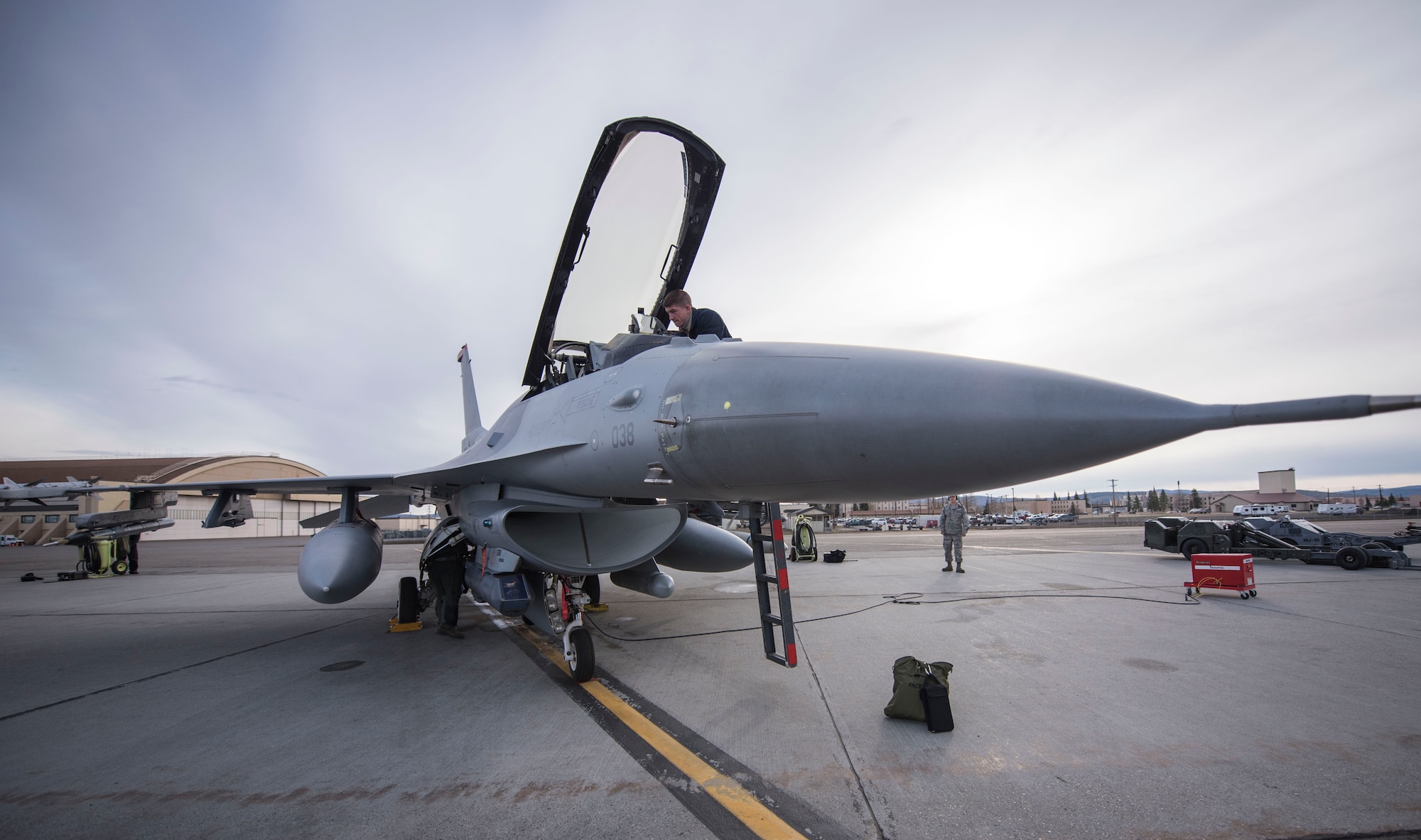 U.S. Air Force Airman 1st Class Andrew Harding a 13th Fighter Squadron crew chief, performs preflight inspections during Northern Edge 2017 at Eielson Air Force Base, Alaska, May 9, 2017. NE17 is a training exercise that provides effective, flexible and capabilities-centered joint forces ready for deployment worldwide and enables real-world proficiency in detection, identification and tracking.  (U.S. Air Force photo by Tech Sgt. Araceli Alarcon)