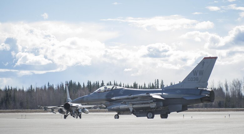 U.S. Air Force F-16 Flying Falcons with the 13th Fighter Squadron from Misawa Air Base, Japan taxi to the runway during Northern Edge 2017 at Eielson Air Force Base, Alaska, May 6, 2017. NE17 provides the opportunity to hone current and test future applications of combat operations and weapons capabilities. (U.S. Air Force photo by Tech Sgt. Araceli Alarcon)