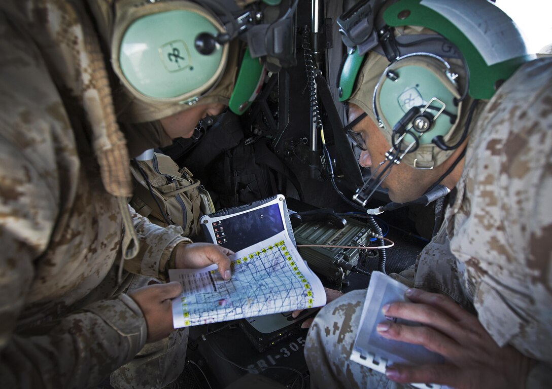 Marines with Marine Light Attack Helicopter Squadron (HMLA) 469, 3rd Marine Aircraft Wing, participate in a command and control exercise during Integrated Training Exercise (ITX) 3-17 aboard Strategic Expeditionary Landing Field (SELF), Marine Corps Air Ground Combat Center Twentynine Palms, Calif., May. 7. ITX is a combined-arms exercise enabling the different sections of an air combat element the opportunity to combine and demonstrate their capabilities in conjunction with the other elements of a Marine air-ground task force. (U.S. Marine Corps photo by Lance Cpl. Becky L. Calhoun/Released)