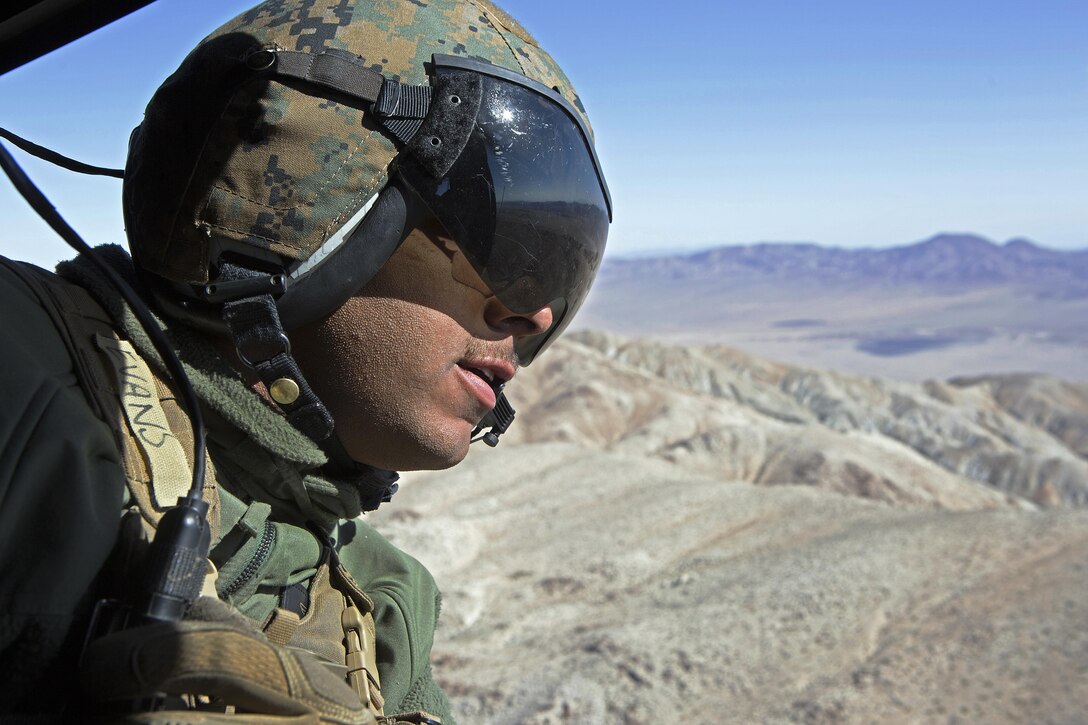 Cpl. Carlton R. Evans, a UH-1Y Huey crew chief with Marine Light Attack Helicopter Squadron (HMLA) 469, 3rd Marine Aircraft Wing, participates in a participates in a command and control exercise during Integrated Training Exercise (ITX) 3-17 aboard Strategic Expeditionary Landing Field (SELF), Marine Air Ground Combat Center Twentynine Palms, Calif., May. 7. ITX is a combined-arms exercise enabling the different sections of an air combat element the opportunity to combine and demonstrate their capabilities in conjunction with the other elements of a Marine air-ground task force. (U.S. Marine Corps photo by Lance Cpl. Becky L. Calhoun/Released)