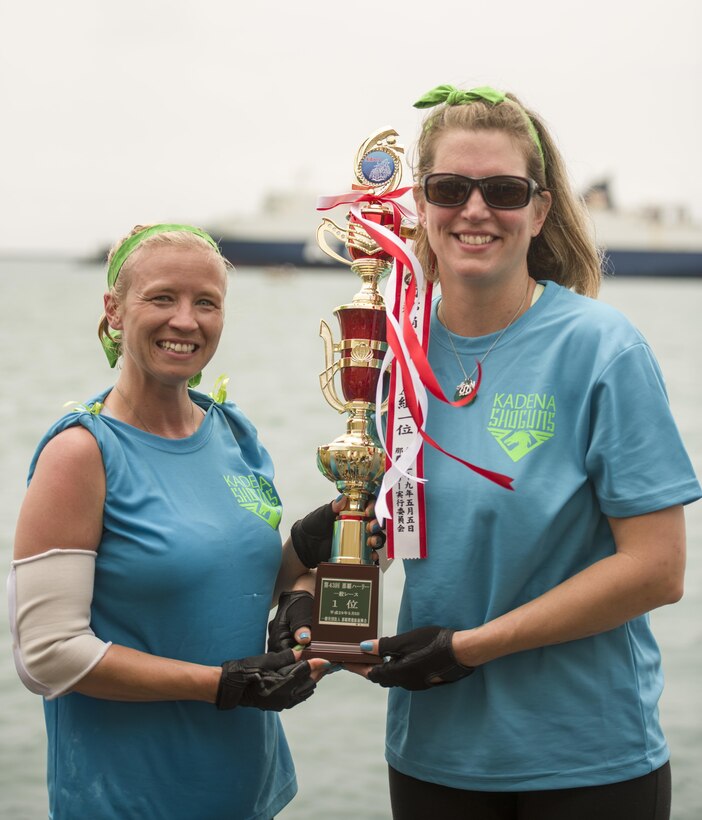 Jessica Bone and Sherry Sawyer, Kadena Shoguns’s Women’s Dragon Boat Team members, hold up a trophy for placing first in their heat May 5, 2017, at Naha Port, Japan. The Kadena Shoguns Women’s Dragon Boat Team defeated the Army’s and Navy’s women’s dragon boat teams to defend their title of best military women’s dragon boat team. (U.S. Air Force photo by Senior Airman Omari Bernard)
