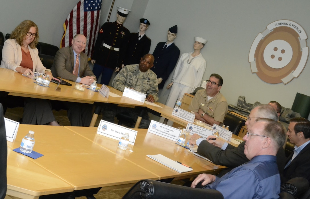 Rear Adm. Peter G. Stamatopoulos (at head of table), the director of fleet ordnance and supply at Navy Fleet Forces Command, receives a briefing about the Clothing and Textile supply chain at DLA Troop Support in Philadelphia May 4. Stamatopoulos visited each of Troop Support’s supply chains and other organizations on Naval Support Activity-Philadelphia. Troop Support plays a large role in Fleet Forces Command’s mission to equip Naval Forces for assignment to combatant commanders. Photo by Shawn J. Jones.