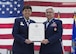 Maj. Gen. Patricia Rose, U.S. Air Force Headquarters mobilization assistant to the deputy chief of staff for logistics, engineering and force protection, presents a certificate of retirement to Col. Anna Schulte, 434th Maintenance Group commander, during her retirement ceremony at Grissom Air Reserve Base, Ind., April 1, 2017. Schulte served more than 34 years in the Air Force. (U.S. Air Force photo/Staff Sgt. Katrina Heikkinen)